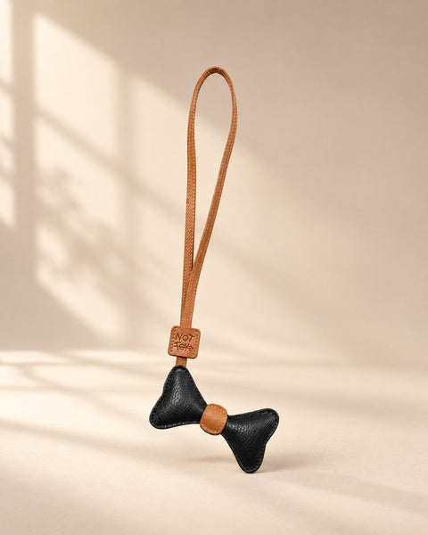 Bowtie Charm in the NOT TOYS sand studio