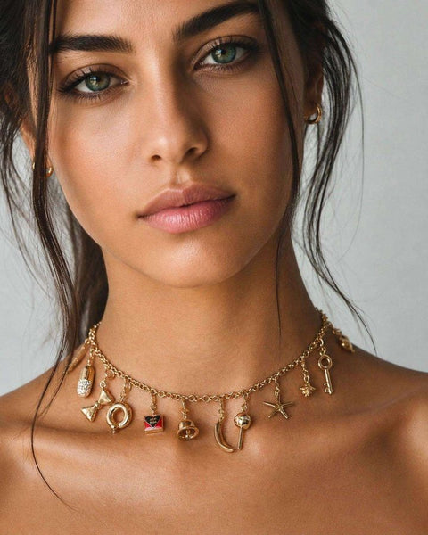 A gold charm choker with small charms