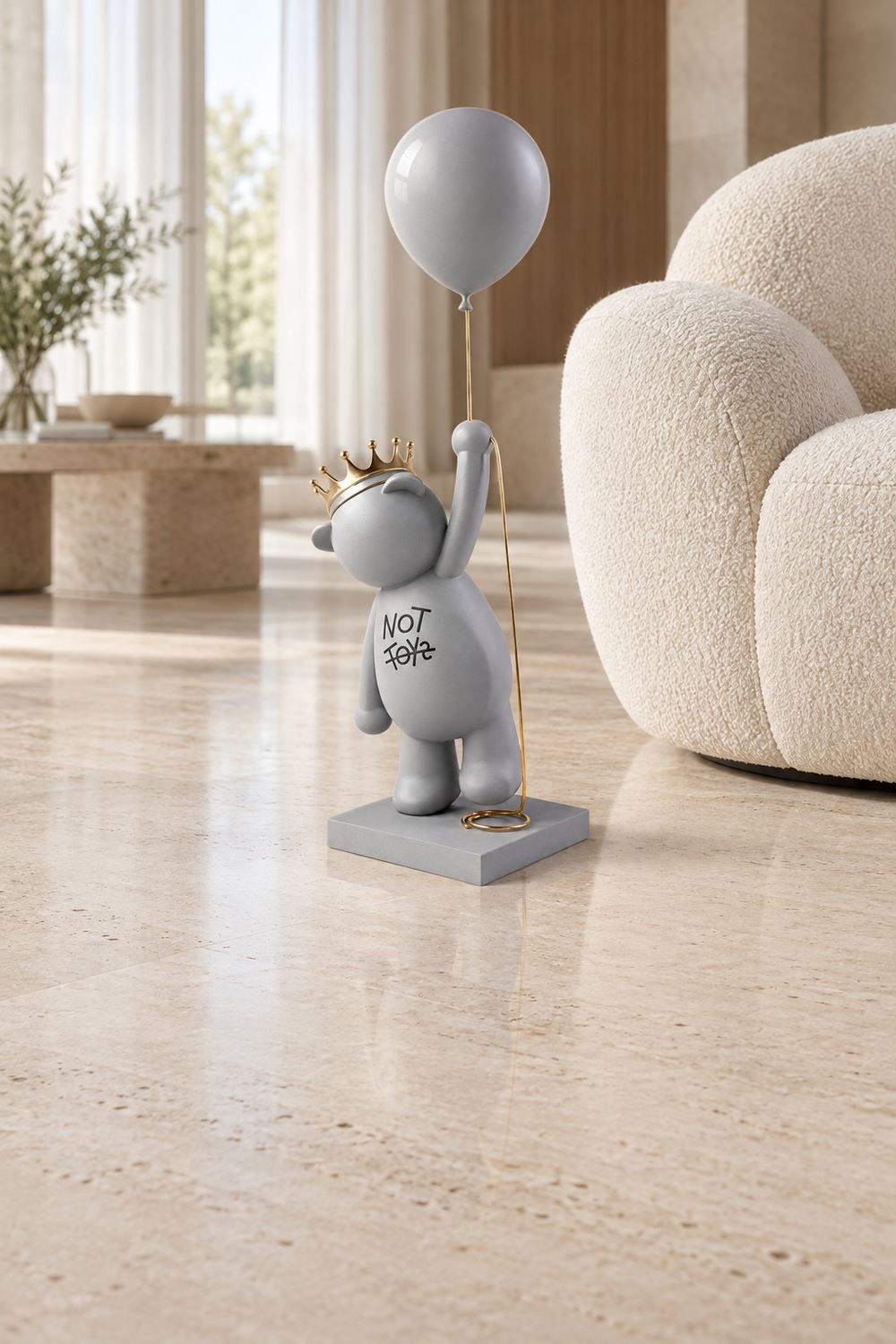 Flying Fudge with his balloon beside a lounge chair in a bright living room